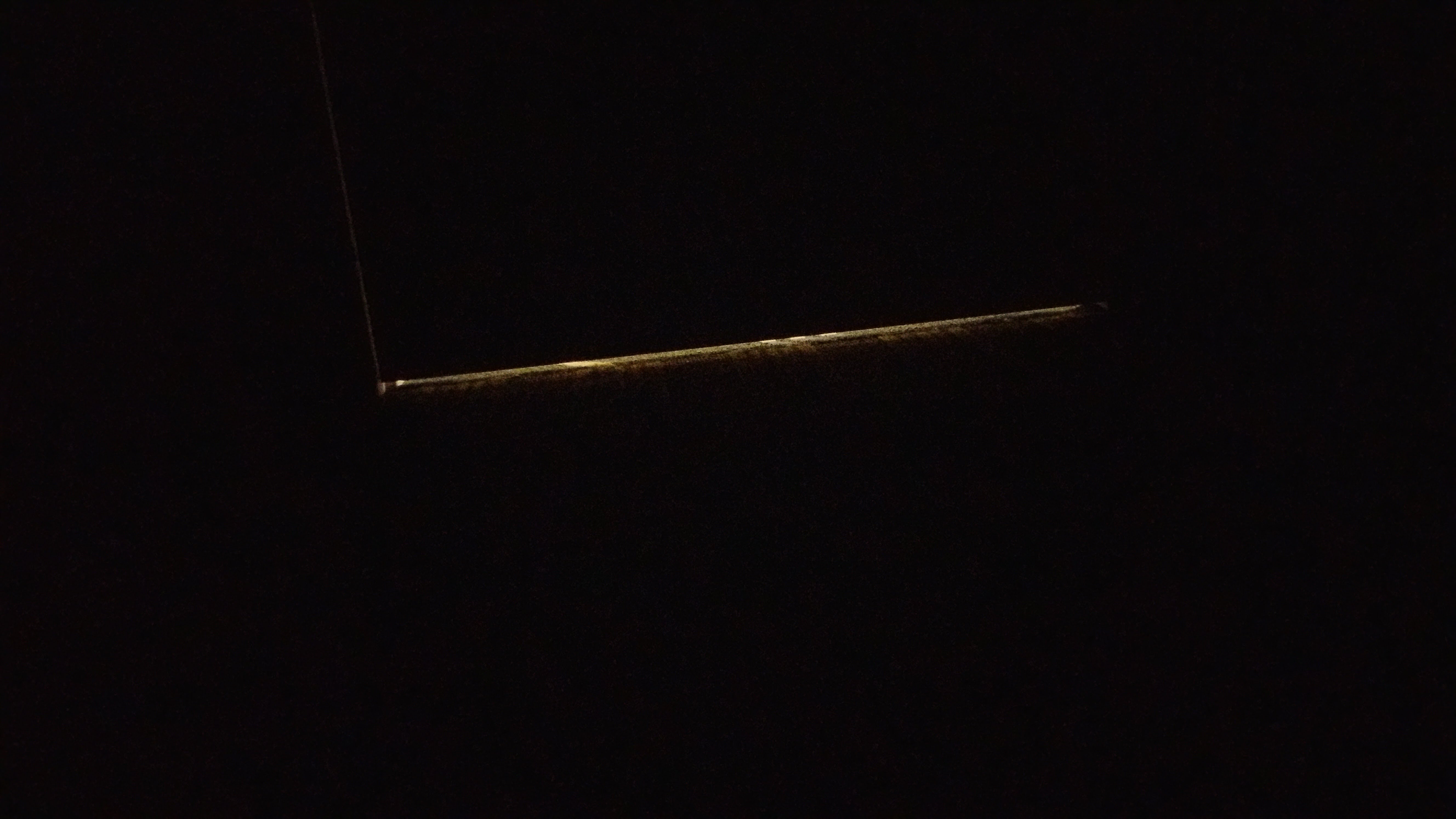 Hotel room door with bottom gap letting in noise Light leaking from the bottom of a hotel room door